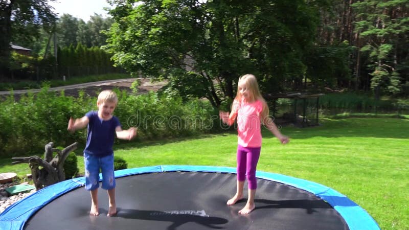 Two Kids Jumping on Trampoline Stock Footage - Video of people, freedom ...
