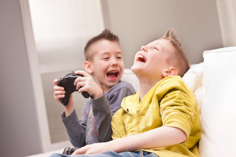 Young People Playing Video Games At Home Stock Photo, Picture and Royalty  Free Image. Image 113583143.