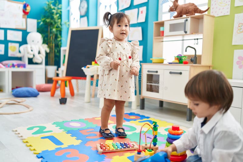 Two Kids Playing Xylophone Standing at Kindergarten Stock Photo Image