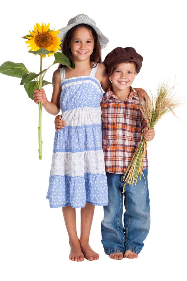 Two kids with sunflower and wheat