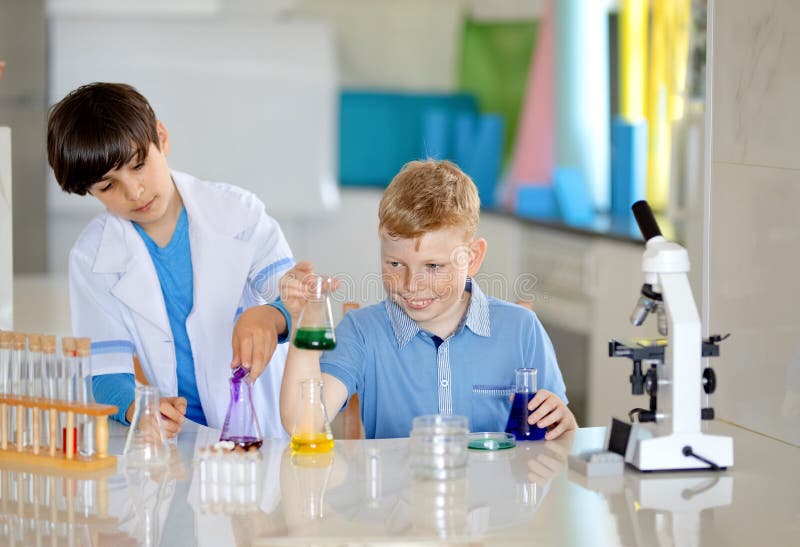 Two Laboratory Assistants Kids Stock Photo - Image of looking, chemical ...