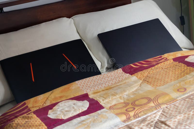 Two Laptops on Bed with Pillows, Lifestyle and Home Office Concept
