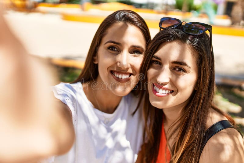 Two Latin Girls Smiling Happy Make Selfie by the Smartphone at the City ...
