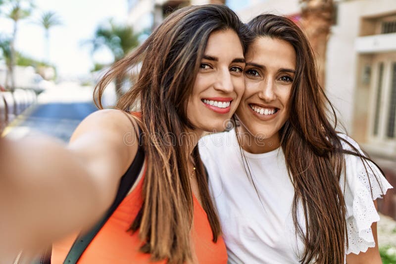 Two Latin Girls Smiling Happy Make Selfie By The Smartphone At The City Stock Image Image Of