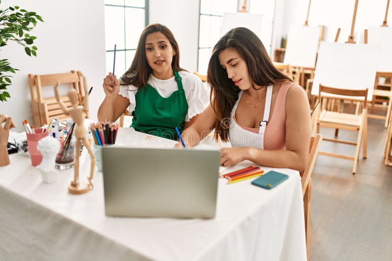 Two Latin Paint Students Smiling Happy Having Online Paint Class at Art