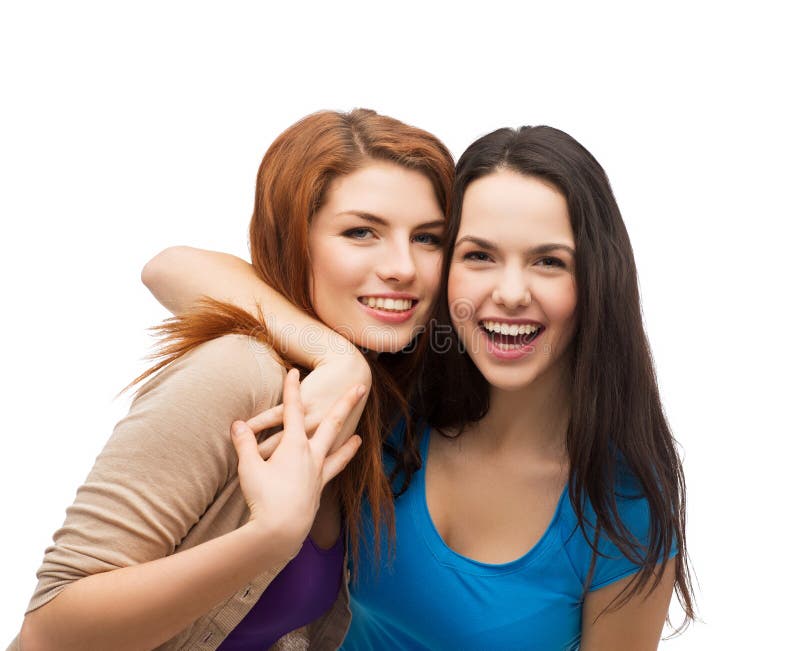 Two laughing girls hugging