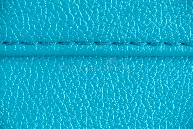 Two layers of blue cyan leather textile sewed stitched tightly together under high magnification close detail photography royalty free stock photography