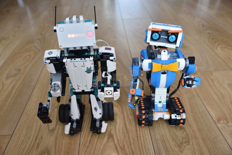 Two Lego robots on the floor
