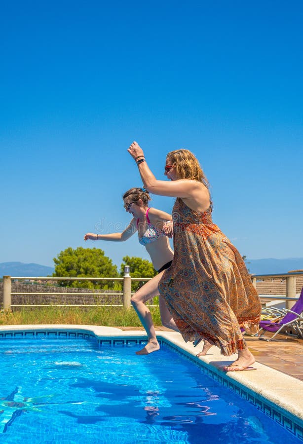 Two Lesbian Couple Friends Laughing with a Shocked Face and Having a Good Time Preparing To Jump