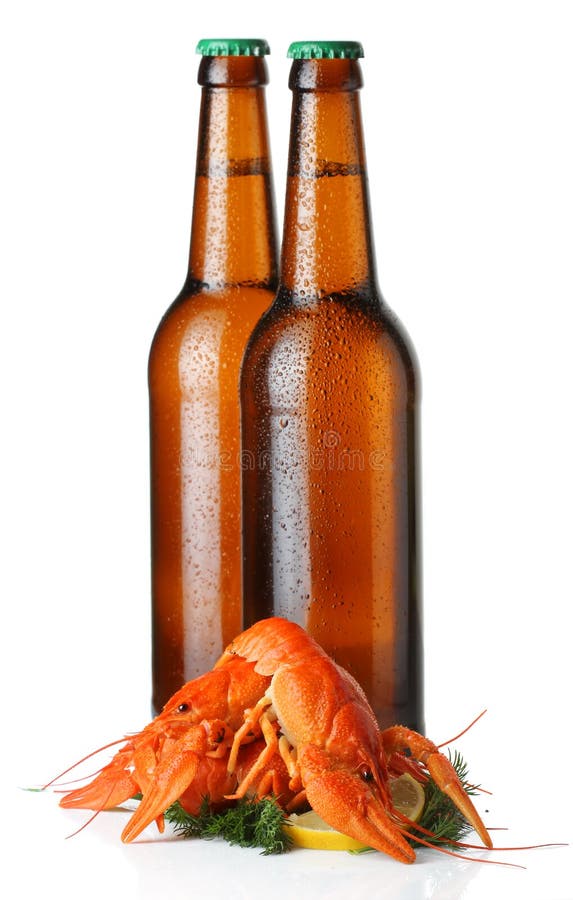 Two light beer bottles and lobsters heap isolated on white stock images Two light beer bottles and lobsters heap isolated on white stock images
