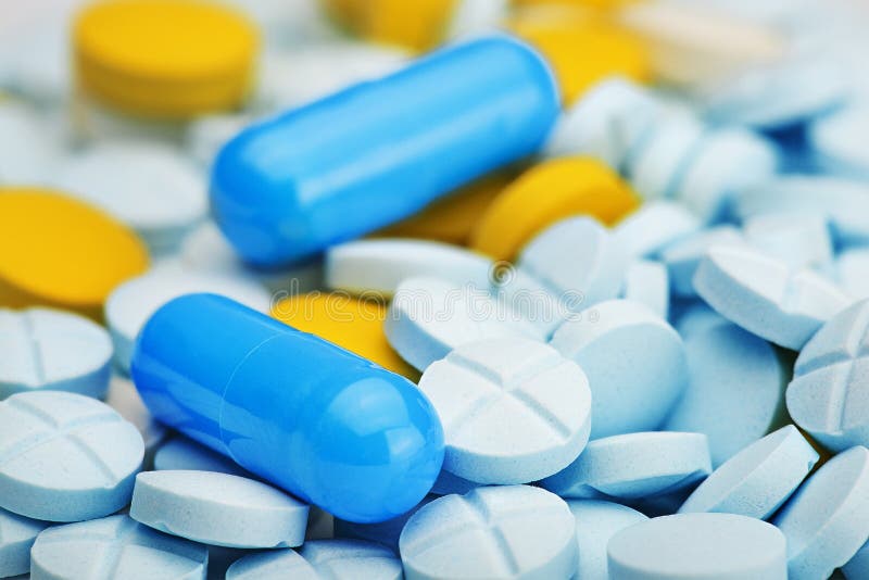 Light Blue Pill in Round Box on a Isolated White Background Stock Image