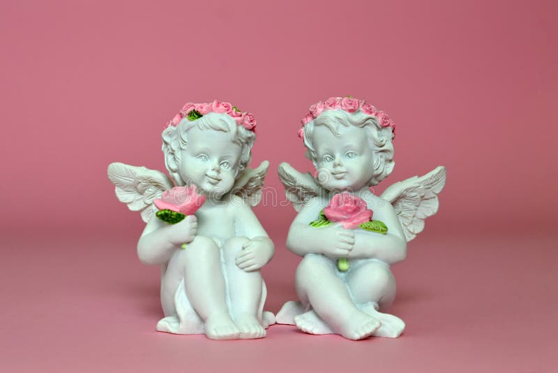 Two little angels holding roses royalty free stock photo Two little angels holding roses royalty free stock photo
