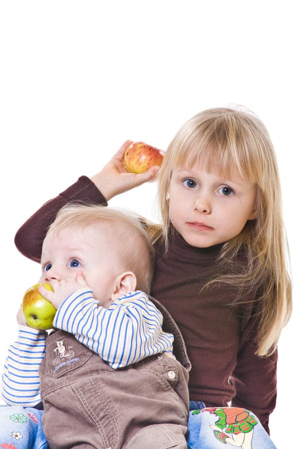 Two little baby eat apples