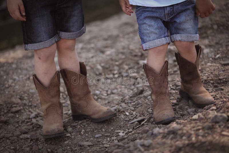 Two Little Boys in Cowboy Boots Close ...