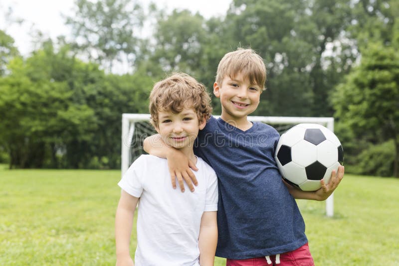 Two Brothers Having Fun Playing with Ball Stock Image Image of game