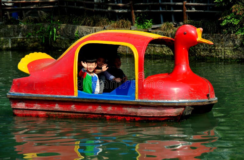 Pengzhou, China: Waving Children On Duck Boat Editorial 