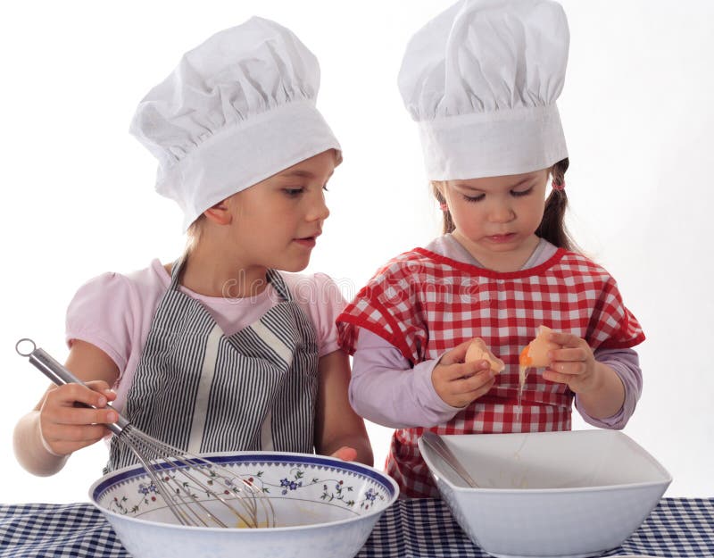 Two little girls in the cook costume