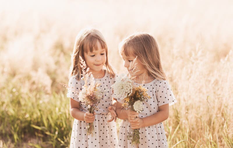 Mom with Two Twin Girls Playing in Nature in the Summer Stock Image ...