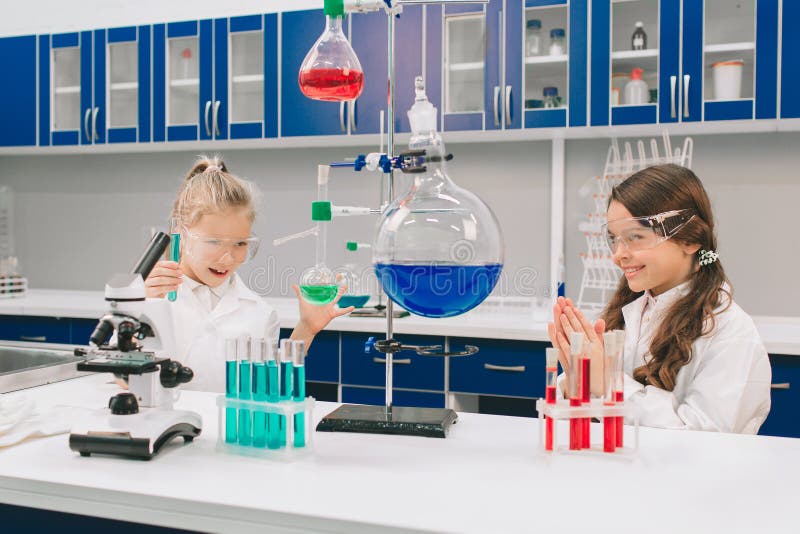 Two Little Kids in Lab Coat Learning Chemistry in School Laboratory ...