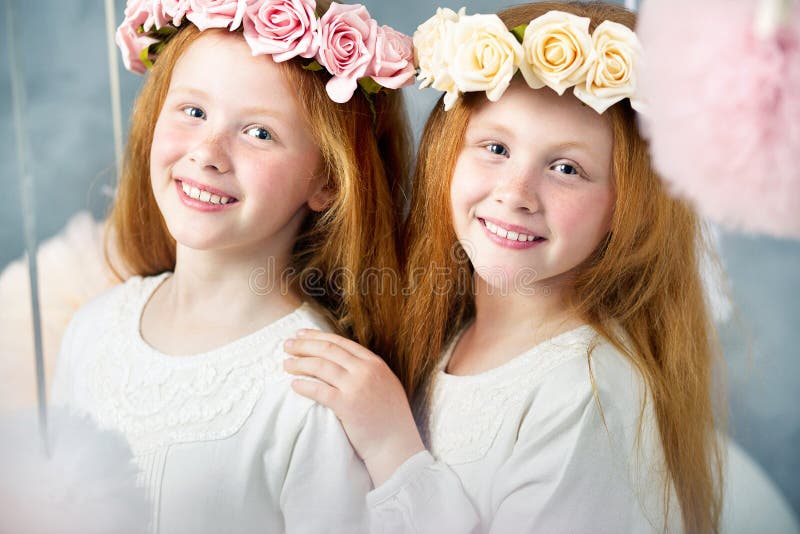 Two little redhead sisters together