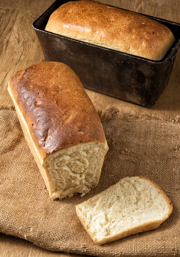 Two Loaves of White Bread on a Rough Cloth Stock Image image