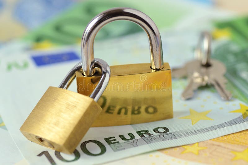 Two loked padlocks on euro banknotes - Concept of financial security