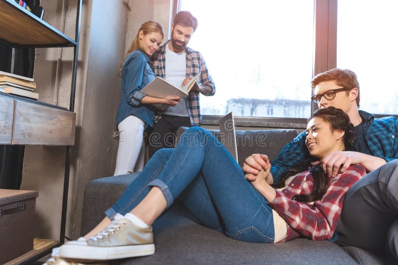 Two loving couples resting in room royalty free stock photo Two loving couples resting in room royalty free stock photo