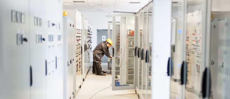 Two maintenance engineer work on relay protection system royalty free stock images Two maintenance engineer work on relay protection system royalty free stock images
