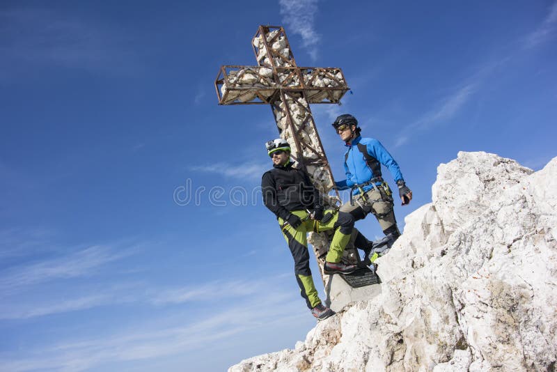 Two men on top of the mountain stock photos Two men on top of the mountain stock photos