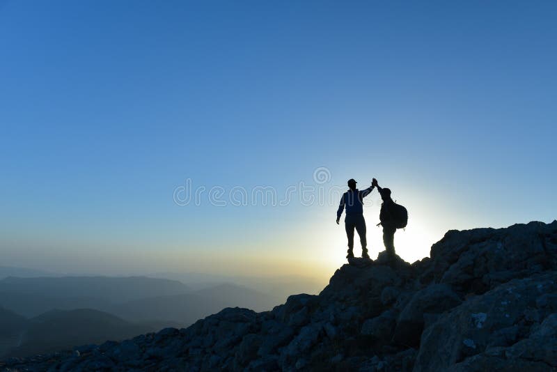 Two man with success gesture on mountain royalty free stock photos Two man with success gesture on mountain royalty free stock photos