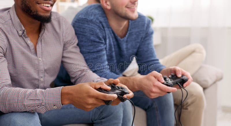 Premium Photo  Excited gamers friends playing video games at home laughing  while watching how is playing online