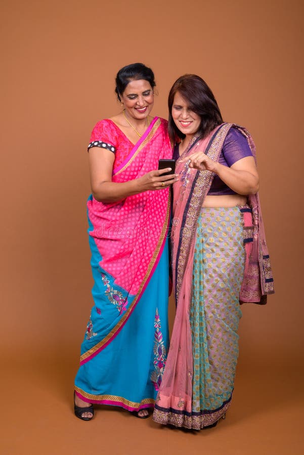 Two Mature Indian Women Wearing Sari Indian Traditional Clothes Together Stock Image Image Of 