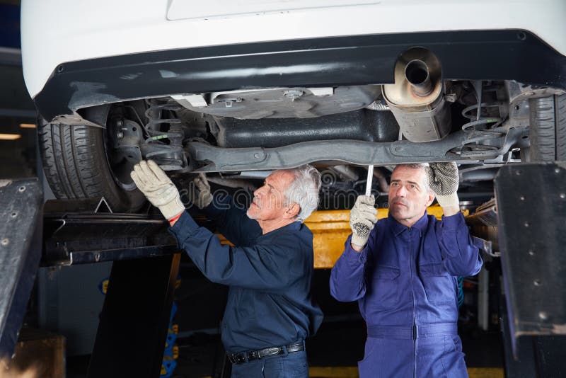 Mechatronics at Underbody Repair on the Car Stock Photo Image of