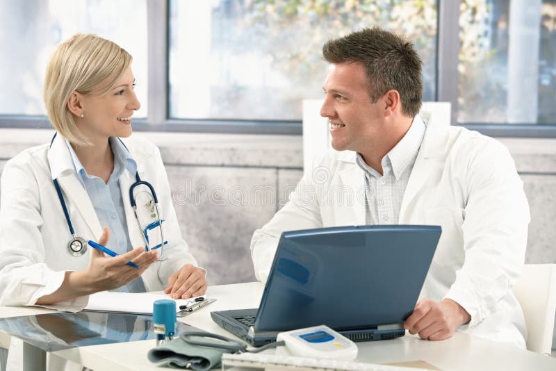 Two Medical Doctors Consulting Stock Photo Image of collaboration, computer 18076784