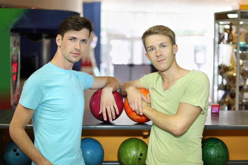 Two Men with Balls Stand in Bowling Club Stock Image Image of people