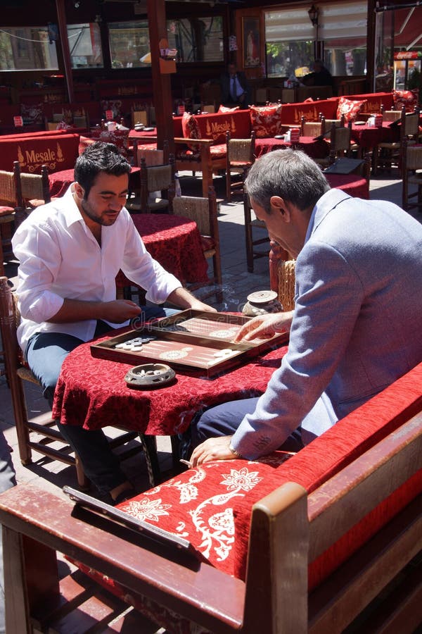 Two men enjoying a game of backgammon