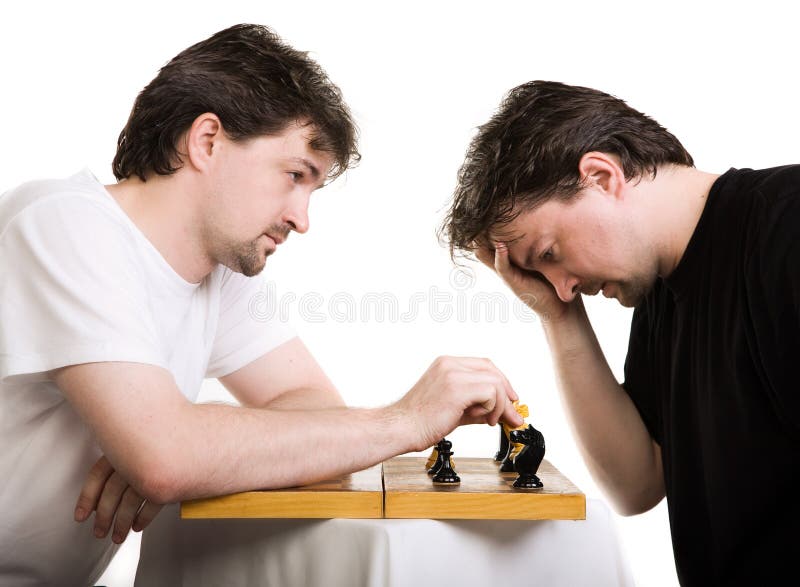 Two men play a chess