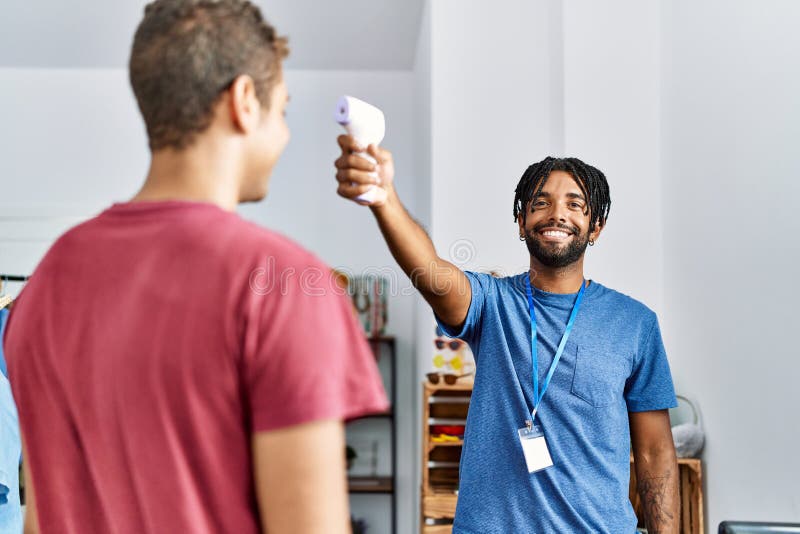 Two Men Shopkeeper and Customer Measuring Temperature at Clothing Store Stock Photo Image of