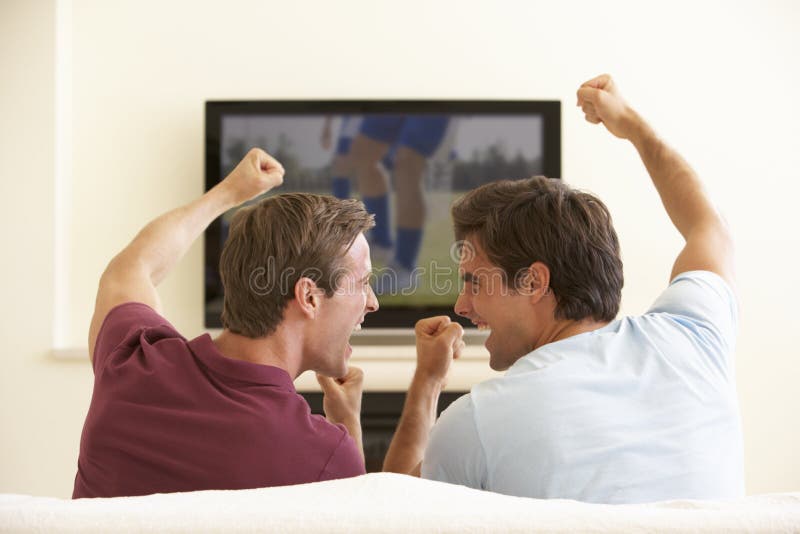 Two Men Watching Widescreen TV At Home