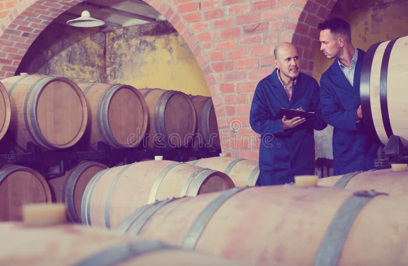 Two Positive Men Winery Employees Writing Note Stock Photos Free & RoyaltyFree Stock Photos