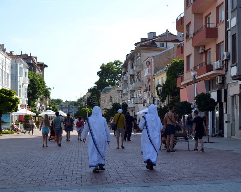 Two missionaries of charity walk along a pedestrian street royalty free stock image Two missionaries of charity walk along a pedestrian street royalty free stock image