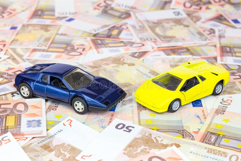 Two model cars on euro bills