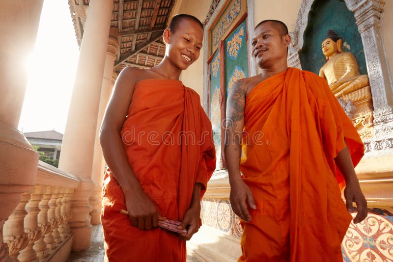 Two monks walk in a buddhist monastery, Asia
