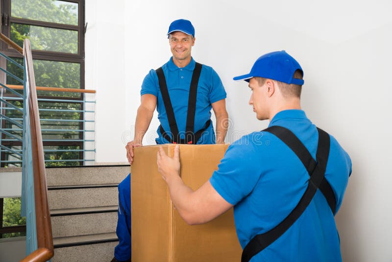 Two Movers Standing With Box On Staircase stock images Two Movers Standing With Box On Staircase stock images