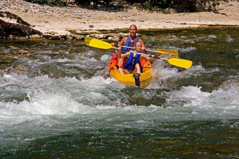 Two people in canoe enjoying holidays