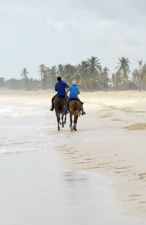 Two people go on horseback