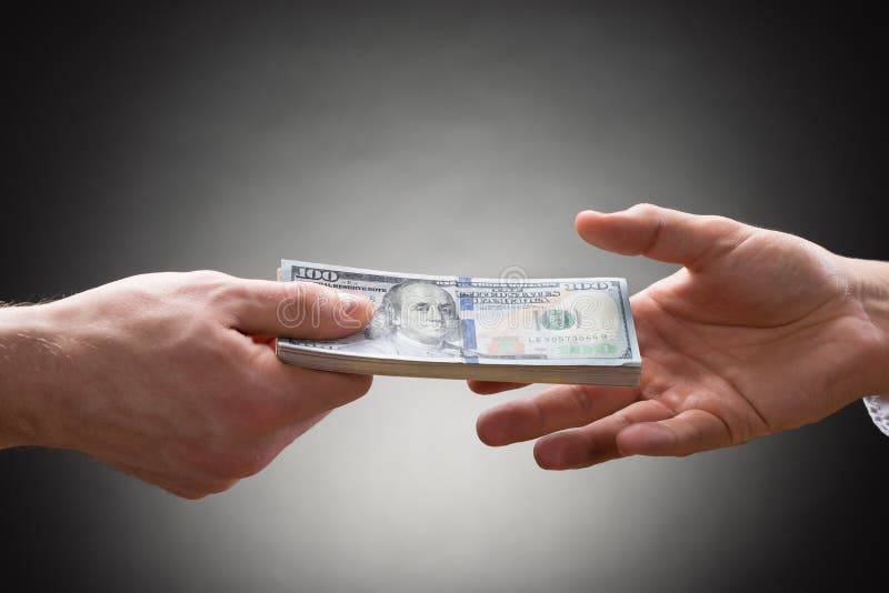 Two people hands with money