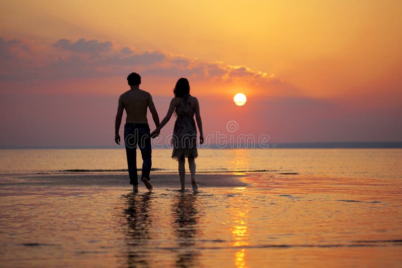 Two people in love at sunset