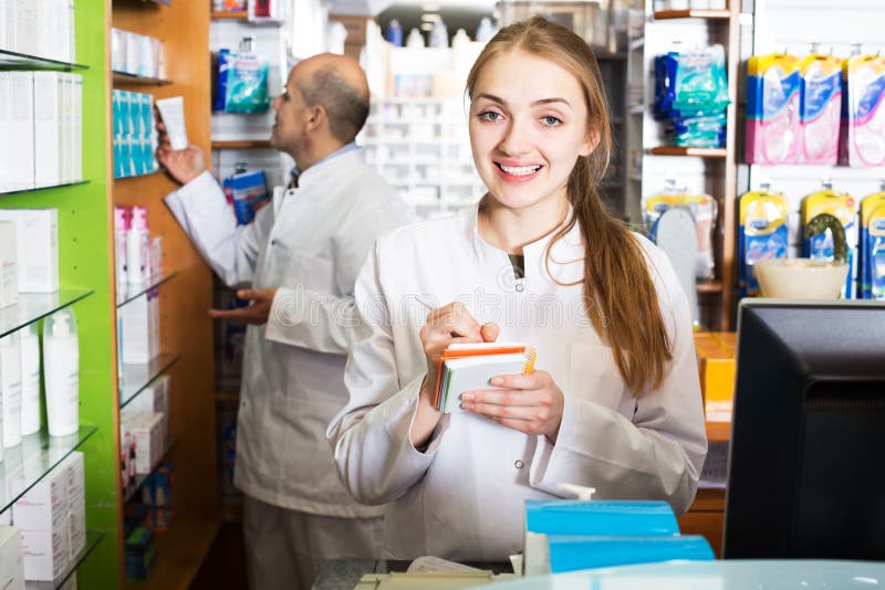 Professional team of pharmaceutist and technician working in chemist shop. Professional team of pharmaceutist and technician working in chemist shop