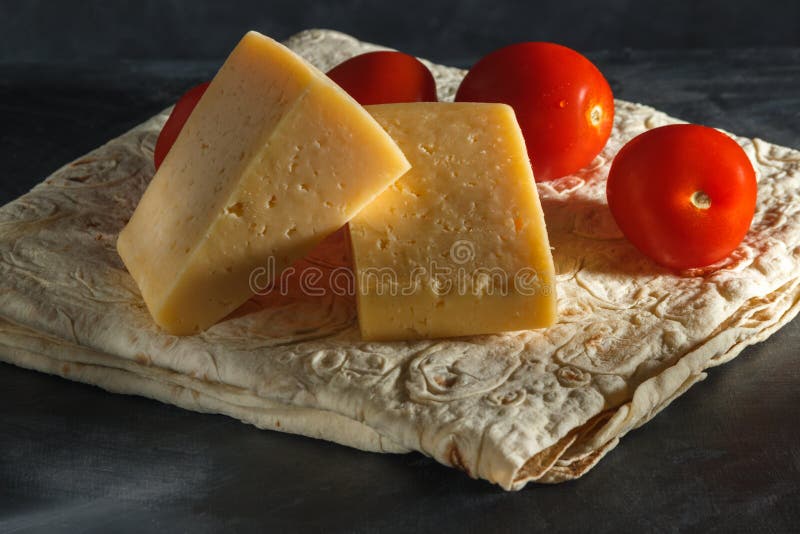Two Pieces of Cheese and Tomatoes, in Armenian Pita Bread Stock Image